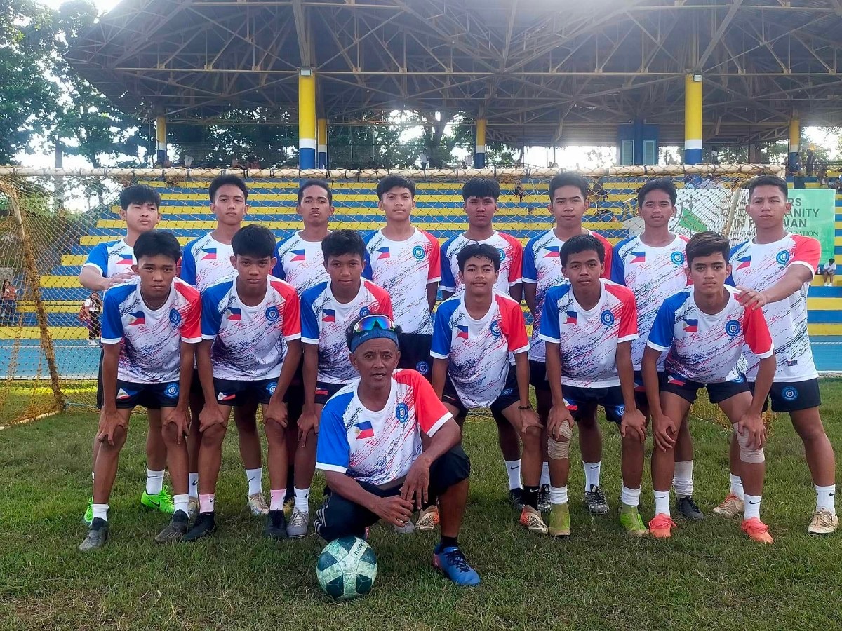 The Palawan soccer team in their 17 shirts with the team logo