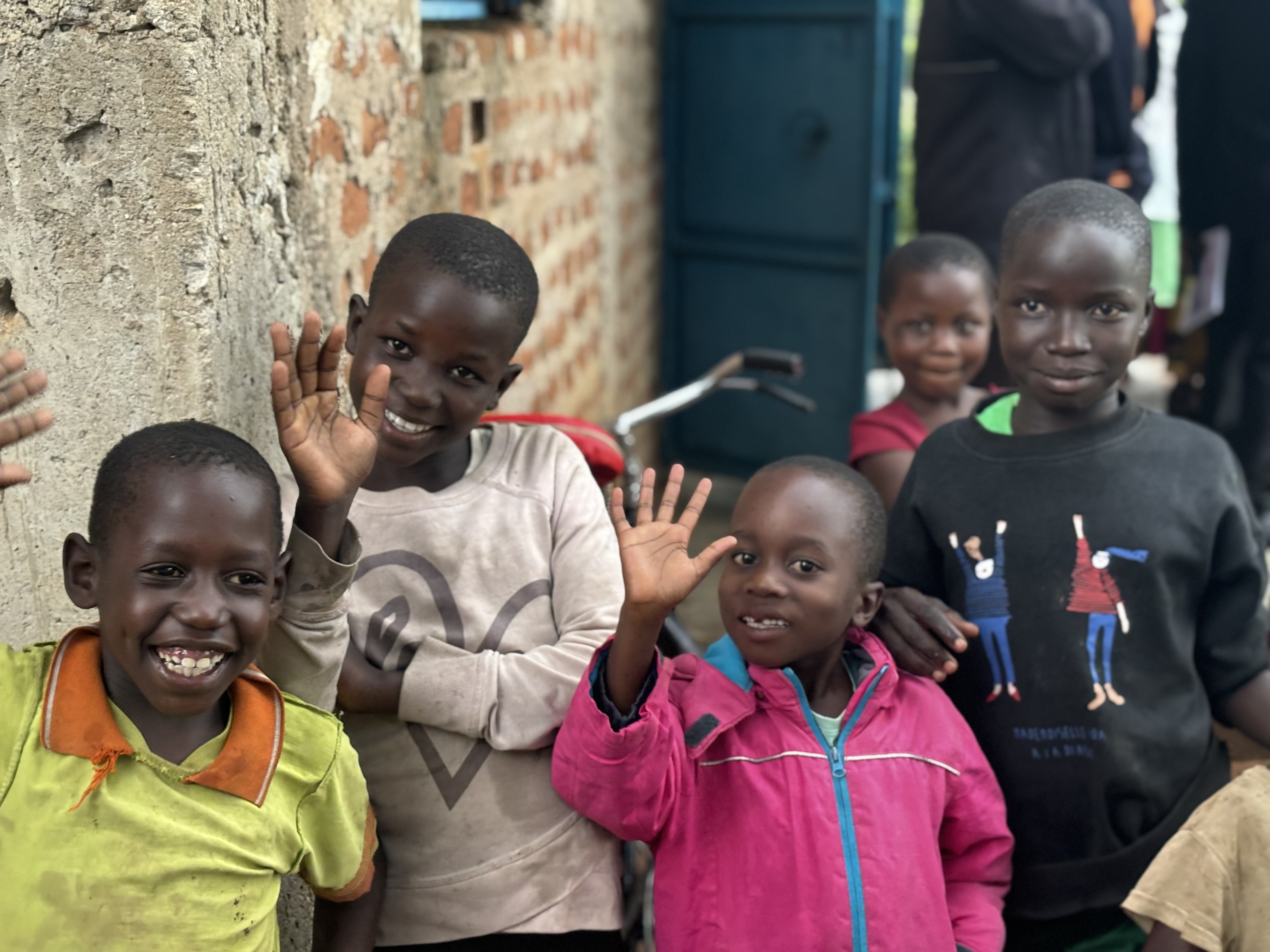 Children smiling in a rural setting