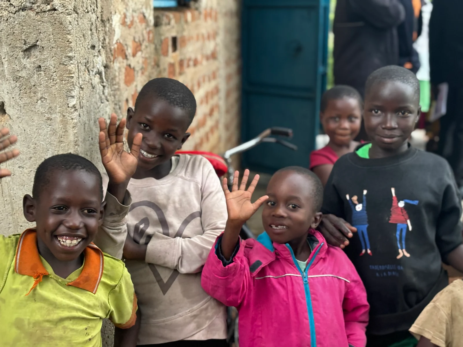 Children smiling in a rural setting