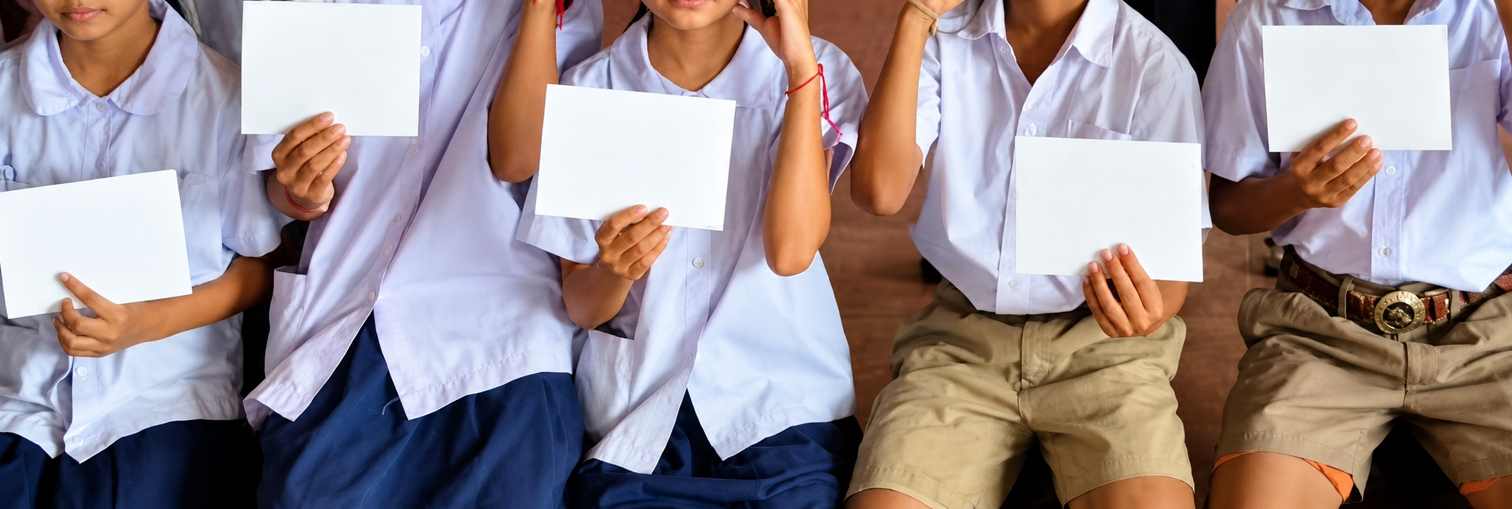 Students holding scholarship envelopes in Thailand